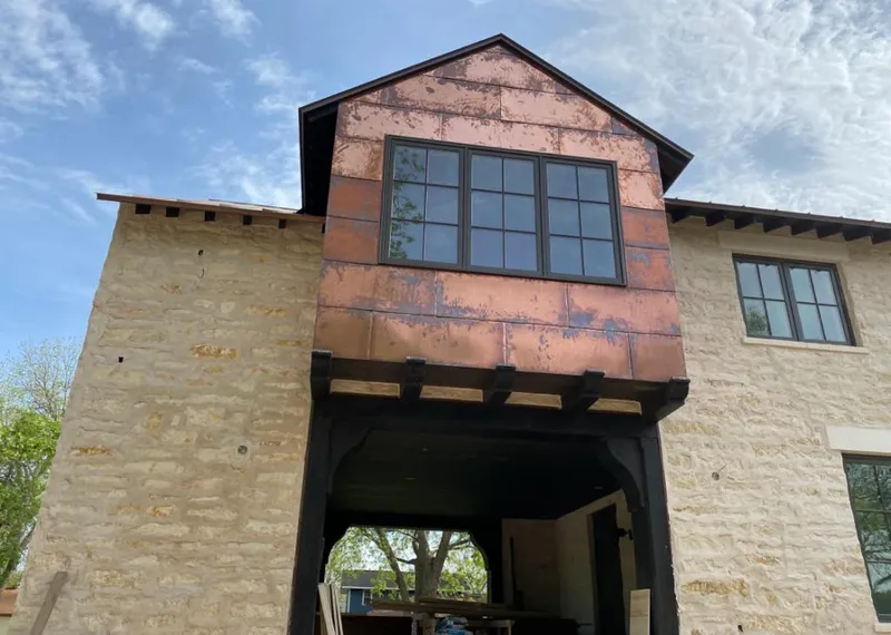 Copper metal panel facade on a stone building for Metal Roof Coating in Fayetteville